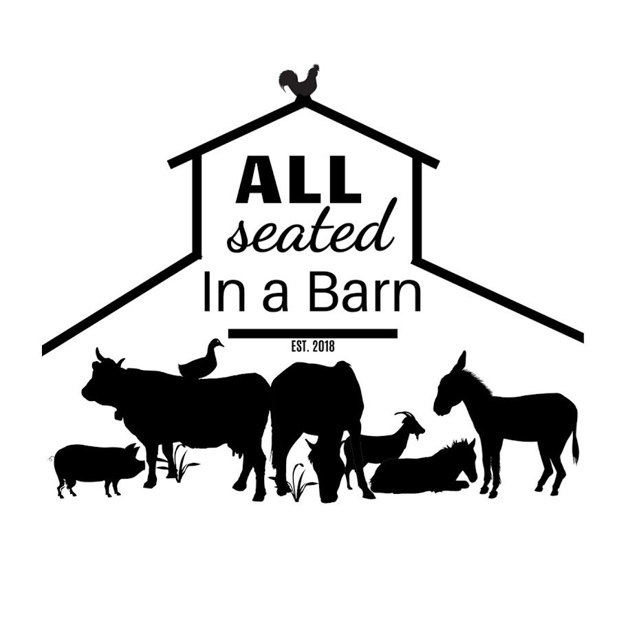 all seated in a barn